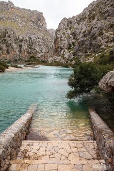 steps lead down to the water in a river