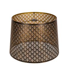 a brown lamp shade that is hanging from a ceiling fixture with an intricate design on it