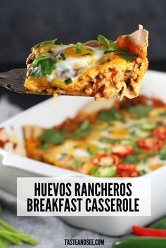 a spoon full of mexican casserole with text overlay that reads, huevoos rancheros breakfast casserole