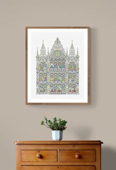 a wooden dresser with a potted plant sitting on top of it next to a wall