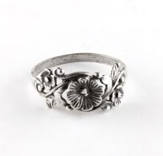 This pretty vintage style ring depicts a vine of pretty flowers and is made of Sterling Silver. The band measures 8mm at its widest point. Handmade to order. Vintage Wedding Toe Ring With Flower Design, Vintage Wedding Flower Toe Ring, Vintage Flower Toe Ring, Vintage Flower Toe Ring As Gift, Vintage Flower Engraved Ring For Anniversary, Vintage Flower Toe Ring Gift, Vintage Flower Toe Ring For Gift, Vintage Flower Shaped Ring As Gift, Vintage Flower Promise Ring