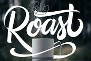 the word roast is written in white lettering on a window sill with a coffee cup next to it