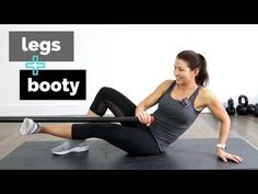 a woman is doing an exercise on a mat with a bar in front of her