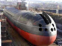 a large jetliner sitting on top of a train track