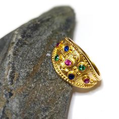 Greek Byzantine Ring K18 Gold-plated Silver 925 and multy-colour Gem stones. This kind of jewelry is coming straight ahead from Byzantine times, when all the empresses wore this beautiful style rings. It is a classic and elegant choise for everyone. A stunning ring that catch the eye. It can be worn by every female at any age and can be matched with every outfit, casual or formal. **you can match it with this bracelet : https://www.etsy.com/listing/1324648159 ✔The ring is decorated with natural gemstones (Zirconia: rubie,emerald,sapphire) . It is available in : ➡ Gold-plated silver 925 ➡Gold 9K ➡Gold 14K 🎁Don't wait anymore..Make this ring yours or give it as a gift.  Decorate your finger with this piece of jewellery and...let your mind feel it's possitive energy  *Dimentions  : Byzantine Ring, Byzantine Rings, Byzantine Jewelry, Roman Jewelry, Vintage Style Rings, Vintage Souvenir, Colored Gems, Gem Stones, Multi Stone Ring