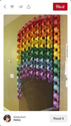 a rainbow made out of toilet paper rolls