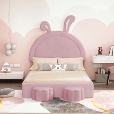 a bedroom with pink walls and an animal themed bed in the center, along with other furniture