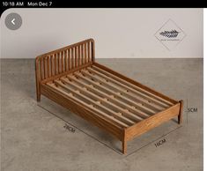 a wooden bed frame is shown with measurements