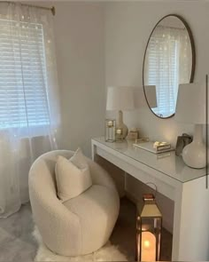 a white chair sitting in front of a mirror on top of a desk next to a lamp