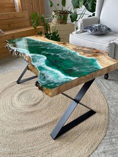 a coffee table that looks like an ocean wave is on display in a living room