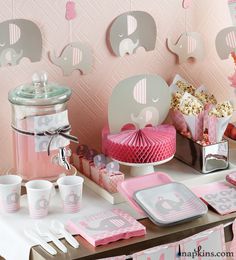 a pink elephant themed birthday party with decorations