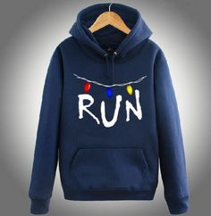 a blue sweatshirt with the word run on it and christmas lights strung across the chest