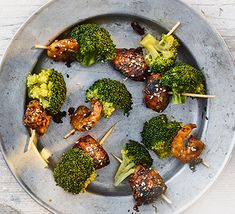 broccoli and meat skewers on a plate