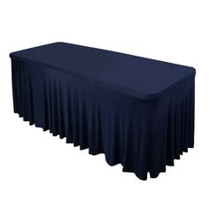 a long table with a blue cover on the top and bottom, in front of a white background