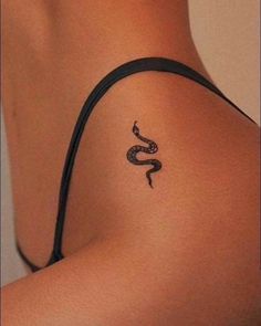 a woman with a tattoo on her shoulder