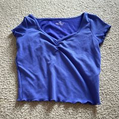 This Hollister Shrunken Cropped Tee Is Never Worn And Is In Great Condition With No Rips Or Stains. It’s A Purple/Blue Color And A Size Small. Purple Stretch Crop Top With Short Sleeves, Casual Purple Crew Neck Crop Top, Purple Y2k Crew Neck Top, Y2k Purple Short Sleeve Tops, Purple Short Sleeve Y2k Style Tops, Purple Short Sleeve Y2k Top, Purple Y2k Short Sleeve Tops, Trendy Stretch Purple T-shirt, Trendy Purple Stretch T-shirt