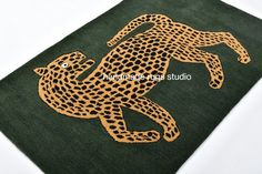 a cheetah and cub rug on a white surface