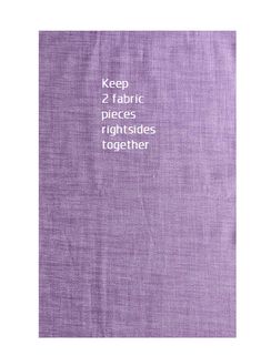 a book with words written in white on the front and purple cover, which reads keep 2 fabric pieces right sides together