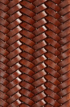 a close up view of a woven leather material