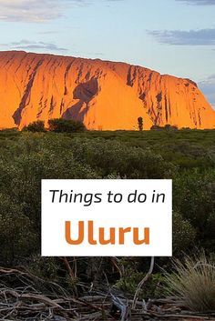 the words things to do in uluru on top of a mountain