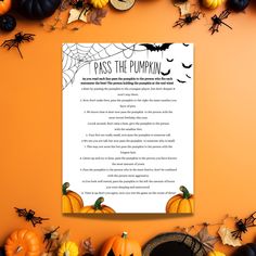 a sheet of paper with words on it surrounded by pumpkins and other halloween decorations