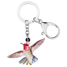 a key chain with a hummingbird painted on it's front and back sides