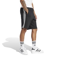 Three stripes for the win! In the adidas 3-Stripe Men's Shorts, you'll be repping your brand with these shorts that are so obviously adidas with their three-stripes. The elastic waistband means they'll stay up well but doesn't require you to be uncomfortable with a button or tight fit. These are ideal for on and off the court and are easy to match with a tee or even a hoodie (if you're into that look in the winter).Features: Features three stripes down side. Has adidas logo on the leg. Elastic w Nba Clothing, Adidas Clothing, Adidas 3 Stripes, Outfit Verano, White Kicks, Just Style, Plus Size Hoodies, Adidas Shorts, Clean Shoes