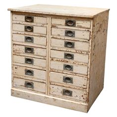 an old wooden cabinet with many drawers