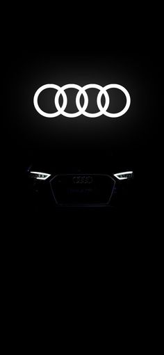 an audi logo is shown in the dark