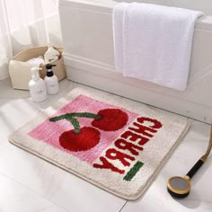 a bathroom rug with cherries on it