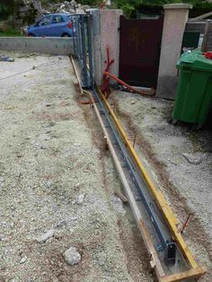 the pipes are connected to the building and being installed on top of the concrete slab