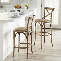 two stools in the middle of a kitchen