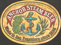 an anchor - steam beer sign on the side of a building in san francisco, california