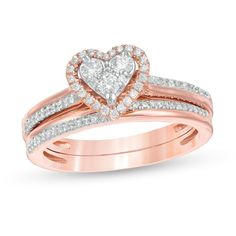 She'll adore the romantic look of this blissful diamond bridal set. Crafted in precious 10K rose gold, the sentimental engagement ring showcases a heart-shaped composite of diamonds - the largest three being 1/20 ct. each - wrapped in an open diamond-lined frame. The double-row shank glistens with a clever arrangement of diamond-lined and polished ribbons. Completing her ensemble, the coordinating wedding ring features a complementing diamond-touched design. Captivating with 1/2 ct. t.w. of diam Heart Shape Rings Engagement Gold, Rose Gold Heart Engagement Ring, Rose Gold Heart Cut Ring For Wedding, Wedding Heart Cut Rose Gold Heart Ring, Rose Gold Heart Cut Jewelry For Proposal, Rose Gold Wedding Jewelry For Valentine's Day, Valentine's Day Rose Gold Wedding Jewelry, Renew Vows, Heart Shaped Engagement Rings