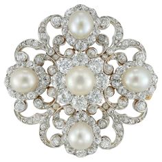 A Victorian diamond and pearl scroll brooch, the central pearl surrounded by a cluster formed of eight old brilliant-cut diamonds, set between four pear-shape pearl and diamond clusters with diamond-set scroll designs in-between, accompanied by GCS Report: 5777-9214 stating that the five pearls are natural saltwater, the diamonds weighing approximately a total of 4 carats, all set in silver to yellow gold back and gold brooch fitting, circa 1880, measuring approximately 3.6cm in diameter, gross Vintage Pearl Brooch, Fantasy Accessories, Diamond Necklace Wedding, Jewellery Diamonds, Victorian Jewellery, Gold Brooch, Antique Brooches, Heart Brooch, Diamond Brooch