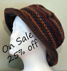 The Brim Beanie is made from Lionbrand Landscapes yarn which is 100% Acrylic and very soft.  The color is shades of blue and brown.  It is made lovingly in a smoke free home.  It is packable for travel or fun for wearing about town.  A good back to school item.  Care instructions are included. Hand or machine Wash, cool water. Dry Flat.  Do Not Iron.   Do Not Bleach. The hat will fit a head circumference of 20"-22" This hat is chemo friendly and made from a pattern by DROPS DESIGN. See other hats in my shop at https://somdesignsandco.etsy.com.  If you like our shop, please link to us at https://somdesignsandco.etsy.com on your favorite social media. Adjustable Warm Crochet Hat For Fall, Warm Adjustable Crochet Hat For Fall, Adjustable Crochet Hat For Fall, Hand Knitted Adjustable Hat For Fall, Adjustable Comfortable Hat For Fall, Brown Bohemian Beanie One Size, Comfortable Adjustable Hat For Fall, Comfortable Adjustable Hats For Fall, Brown Hand Knitted Crochet Hat For Beach