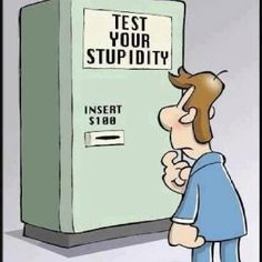 a man is standing in front of a machine that says, test your stupidity seems legit