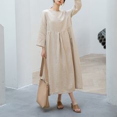 "Cool and comfortable for hot summer days, this natural linen dress is elegant and stylish.    It is a wonderful wardrobe staple that's a timeless classic you'll wear again and again.Pure natural linen materials, comfortable, breathable, refreshing and soft fabric. All our items are Tailored and Handmade and Made to Order ,I can make Any Size . I design new styles every week, please collect my store. I believe that you will meet your favorite styles. ★★FEATURES Linen 55% + Cotton 45% ( Medium Weight，Comfortable, Breathable and Washed Soft fabric) Two side pockets Round neckline 3/4 sleeve Pleated waist details Loose linen dress Casual dress Long linen dress Simple dress Perfect for Summer, Spring ★★Size Chart: ❤ Size chart is the garment's measurements, Not body measurements . Size S: Leng Beige A-line Linen Dress For Spring, Spring Beige A-line Linen Dress, Beige Linen Dress For Summer, Casual Beige Linen Dress, Spring Daywear Linen Dress, Casual Summer Dress Made Of Flax, Cream A-line Linen Dress, Spring Linen Dress For Daywear, Beige Flax Summer Dresses