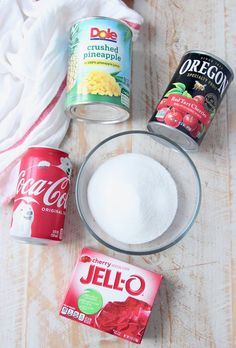 ingredients to make jello on a table including sugar, yogurt and other items