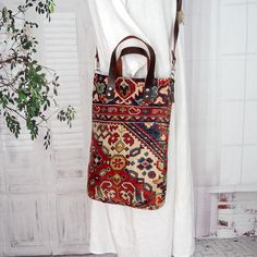 This exotic carpet bag meets all your daily needs, whether you're going to university, work, shopping, or travel! Made of vintage velvet carpet. The handles and accesories made in maroon color genuine buffalo leather. Soft and velvety an inner pocket. Closure with screw button Dimensions: Width: 27 cm Height: 38 cm Depth 7 cm Length of handle approx 33 cm Long strap (attacheble) adjustable approx in 100 - 115 cm COLOURS I do my best to portray the colors as accurately as possible. Unfortunately, I can't guarantee that any color on the monitors is exactly the same as the color I'm showing. Thanks and happy shopping! Tapestry Top Handle Shoulder Bag For Everyday Use, Tapestry Satchel Shoulder Bag For Daily Use, Top Handle Tapestry Shoulder Bag For Daily Use, Everyday Tapestry Shoulder Bag With Top Handle, Tapestry Shoulder Bag With Top Carry Handle For Everyday, Everyday Tapestry Top Handle Shoulder Bag, Tapestry Shoulder Bag With Handles For Daily Use, Bohemian Satchel With Detachable Handle And Crossbody Shape, Bohemian Shoulder Bag For Everyday Use