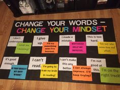 a bulletin board with words that say change your words, change your minds and i can't give it up