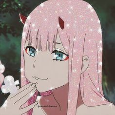 a girl with pink hair and blue eyes holding a flower in front of her face