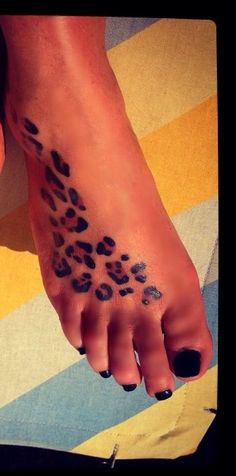 a woman's foot with a leopard print on it