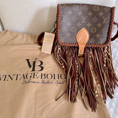 Brand New From Vintage Boho Bags, Louis Vuitton Up Cycled Monogram Canvas Cartouchiere Crossbody Bag -Flap Top And Buckle Closure -2 Separate Interior Compartments -Holds A Lot -Measurements Are Approximately: 7” L X 8 1/2” W X 2 1/2”D -Dirty Blonde Fringe -Braided Leather Strap -Rare Find As It Is No Longer On Their Site -Brand New From Vintage Boho Bags, Tag Still On It -Pet And Smoke Free Home Louis Vuitton Western Purse, Blonde Fringe, Boho Crossbody Bag, Western Purses, Bags Louis Vuitton, Luxury Purses, Boho Bags, Dirty Blonde, Braided Leather