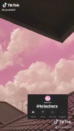 the sky is pink and there are clouds in the background with an instagram message below