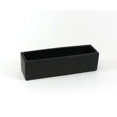 a black rectangular container sitting on top of a white table