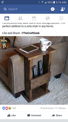 a small table with magazines on it and a coffee cup sitting on top of it