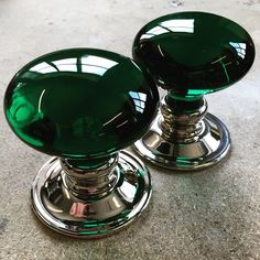 two shiny green knobs on top of each other