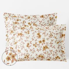 two pillow cases with yellow flowers on them