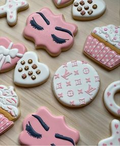 decorated cookies are arranged on a table